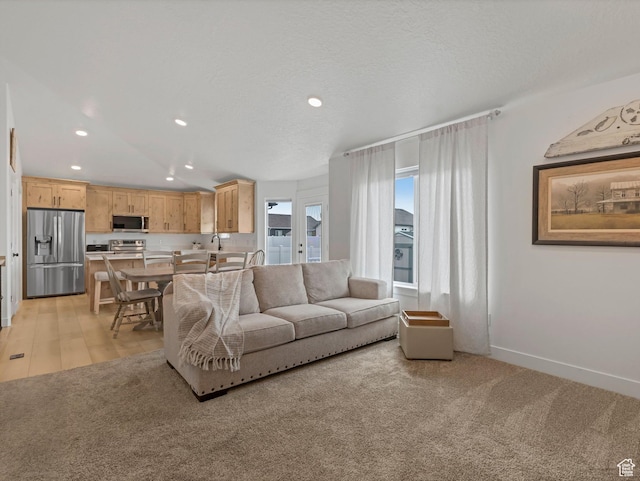 1245 N Clemente Way, Tooele, UT 84074 - living area with recessed lighting, light carpet, and baseboards