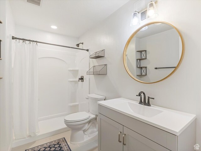 1245 N Clemente Way, Tooele, UT 84074 - full bath featuring toilet, a shower with shower curtain, vanity, and tile patterned floors