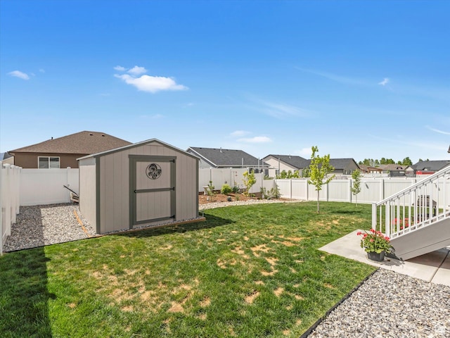 1245 N Clemente Way, Tooele, UT 84074 - view of yard with a shed, a residential view, an outbuilding, and a patio