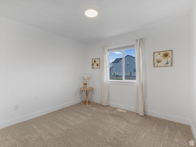 1245 N Clemente Way, Tooele, UT 84074 - spare room featuring light carpet and baseboards