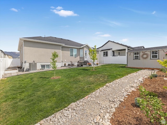 1245 N Clemente Way, Tooele, UT 84074 - back of house with a patio, stucco siding, and entry steps