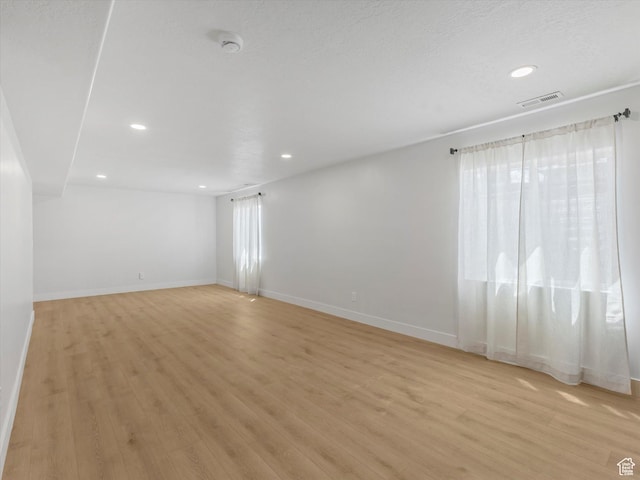 1245 N Clemente Way, Tooele, UT 84074 - unfurnished room featuring a smoke detector, light wood-type flooring, recessed lighting, and baseboards