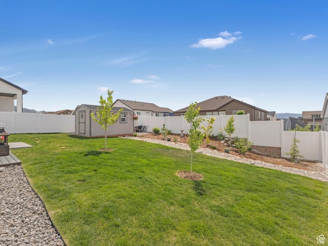 1245 N Clemente Way, Tooele, UT 84074 - view of yard featuring a storage unit, an outbuilding, and a residential view