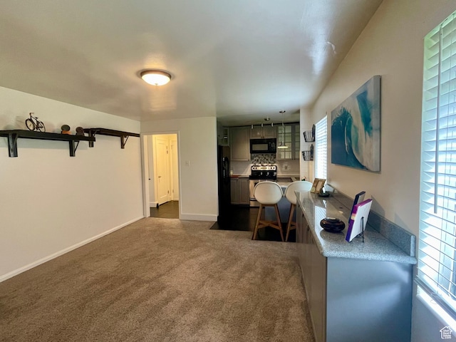 living room featuring dark colored carpet and baseboards