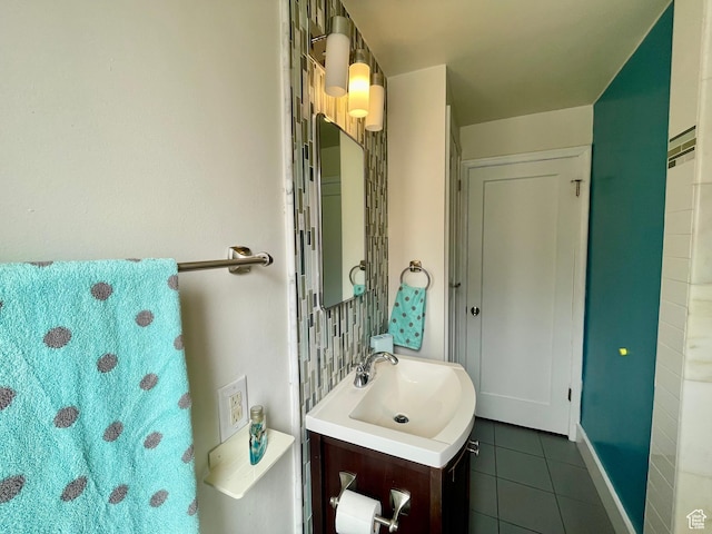 bathroom featuring tile patterned flooring and vanity
