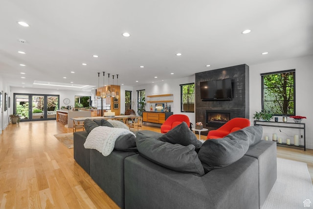 1863 E Hubbard Ave, Salt Lake City, UT 84108 - living room with recessed lighting, a fireplace, light wood-style floors, and healthy amount of natural light