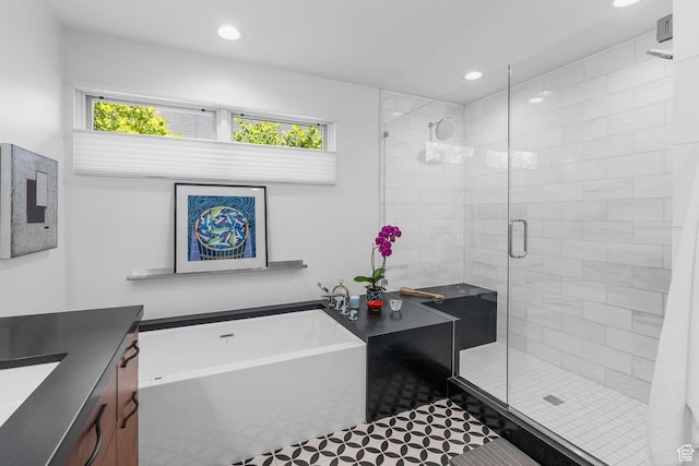 1863 E Hubbard Ave, Salt Lake City, UT 84108 - bathroom featuring recessed lighting, a shower stall, a bathtub, vanity, and tile patterned floors