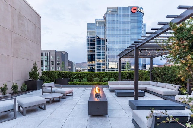 268 S State St E Unit 417, Salt Lake City, UT 84111 - view of patio featuring an outdoor living space with a fire pit, a pergola, and a view of city