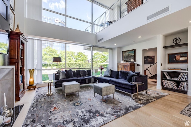 268 S State St E Unit 417, Salt Lake City, UT 84111 - living area featuring a high ceiling and wood finished floors