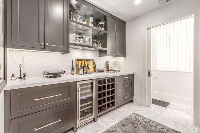 268 S State St E Unit 417, Salt Lake City, UT 84111 - indoor dry bar with wine cooler, light marble finish flooring, baseboards, decorative backsplash, and recessed lighting