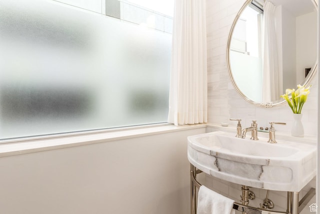 268 S State St E Unit 417, Salt Lake City, UT 84111 - bathroom with decorative backsplash and a sink