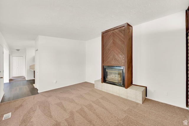 unfurnished living room with carpet floors and baseboards