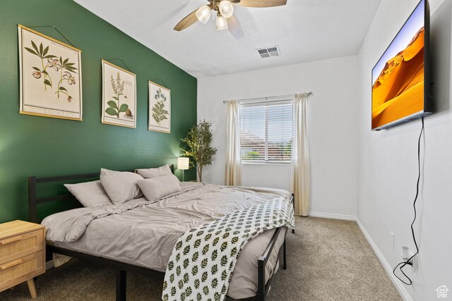 bedroom featuring carpet flooring, baseboards, and ceiling fan
