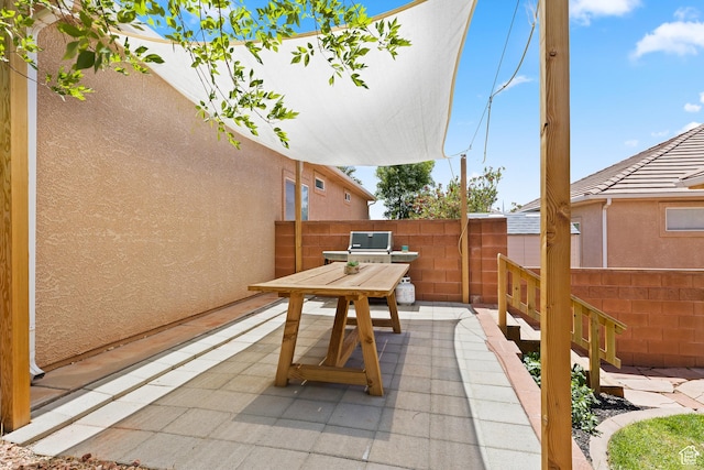 view of patio with fence