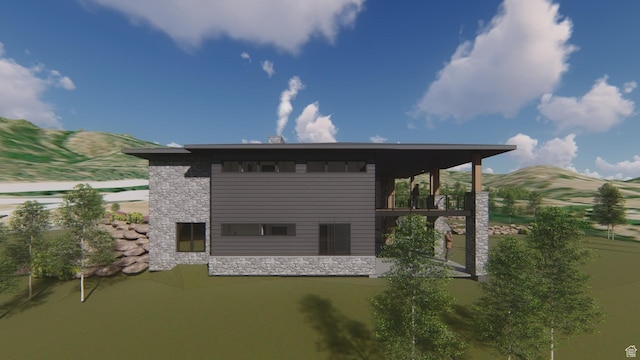 back of house featuring stone siding and a mountain view