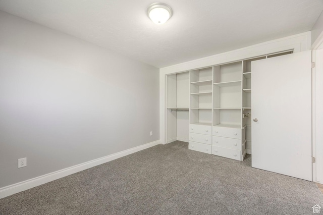 9614 S 1210 E, Sandy, UT 84094 - unfurnished bedroom featuring carpet, a closet, and baseboards