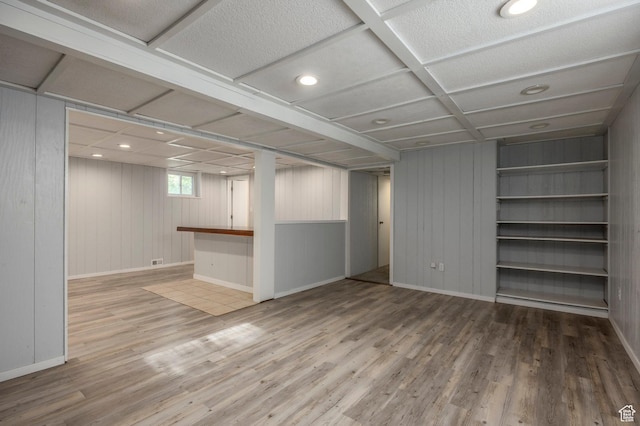 9614 S 1210 E, Sandy, UT 84094 - basement featuring wood finished floors, baseboards, and wooden walls