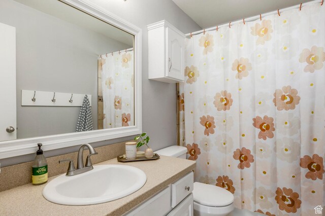 9614 S 1210 E, Sandy, UT 84094 - bathroom with vanity, toilet, and curtained shower