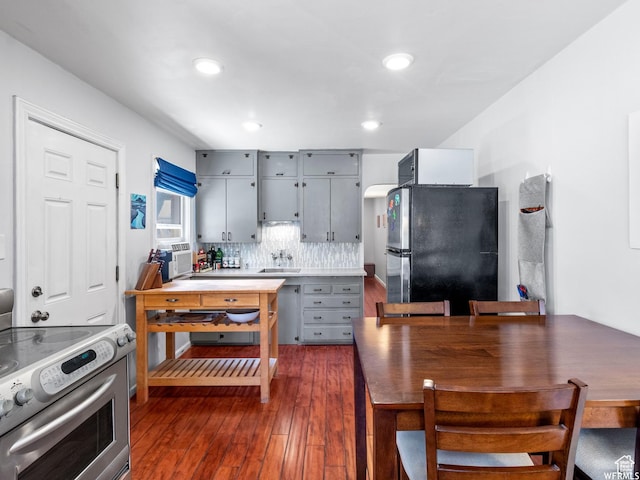 1318 E 300 S, Salt Lake City, UT 84102 - kitchen with appliances with stainless steel finishes, gray cabinetry, dark wood finished floors, a sink, and tasteful backsplash