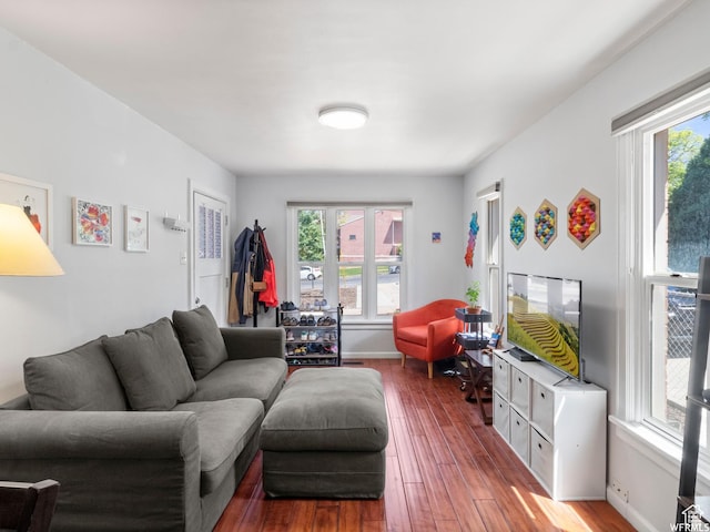 1318 E 300 S, Salt Lake City, UT 84102 - living area featuring plenty of natural light, wood finished floors, and baseboards
