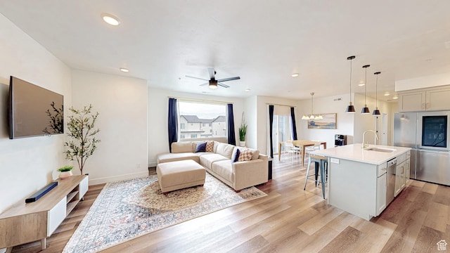 376 S 1080 W Unit 301, American Fork, UT 84003 - living area with light wood-style floors, recessed lighting, a ceiling fan, and baseboards