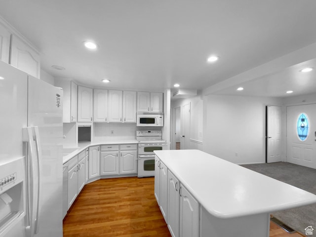 2987 S Eucalyptus Way, West Valley City, UT 84119 - kitchen featuring white appliances, recessed lighting, white cabinetry, a kitchen island, and light countertops