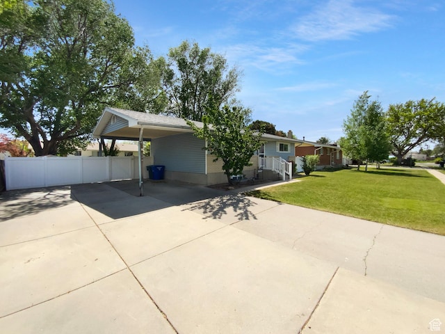 2987 S Eucalyptus Way, West Valley City, UT 84119 - view of front of home with driveway and an attached carport