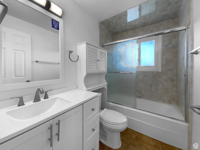 2987 S Eucalyptus Way, West Valley City, UT 84119 - full bath with vanity, toilet, bath / shower combo with glass door, and tile patterned flooring