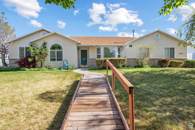 5659 W Adeline Ct, Herriman, UT 84096 - ranch-style home with stucco siding, brick siding, and a front yard
