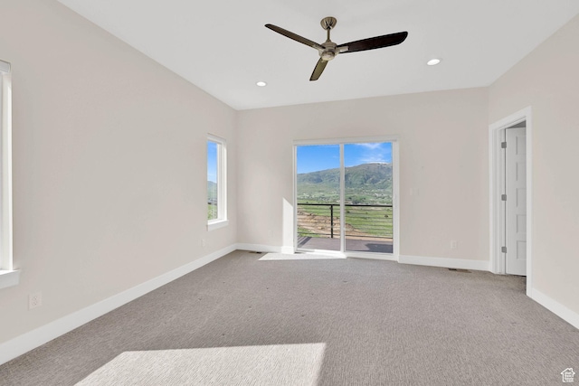 4491 N Seven Bridges Rd, Eden, UT 84310 - empty room with carpet flooring, ceiling fan, baseboards, a mountain view, and recessed lighting
