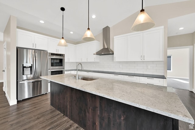 4491 N Seven Bridges Rd, Eden, UT 84310 - kitchen featuring appliances with stainless steel finishes, a sink, wall chimney range hood, tasteful backsplash, and recessed lighting