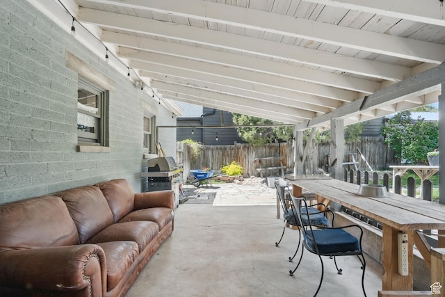 view of patio featuring a fenced backyard, an outdoor hangout area, and grilling area