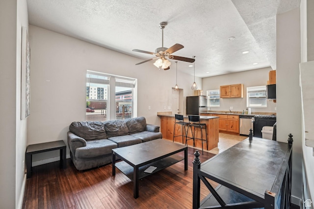 125 W 800 S, Salt Lake City, UT 84101 - living area with a textured ceiling, ceiling fan, light wood-type flooring, and recessed lighting