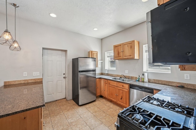 125 W 800 S, Salt Lake City, UT 84101 - kitchen with appliances with stainless steel finishes, a sink, pendant lighting, a textured ceiling, and dark countertops