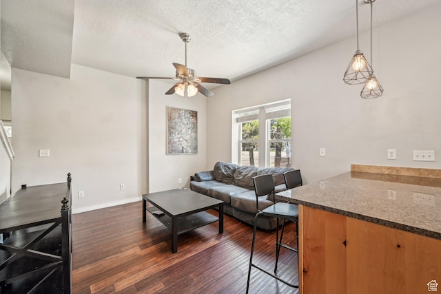 125 W 800 S, Salt Lake City, UT 84101 - living area with ceiling fan, dark wood-style floors, a textured ceiling, and baseboards