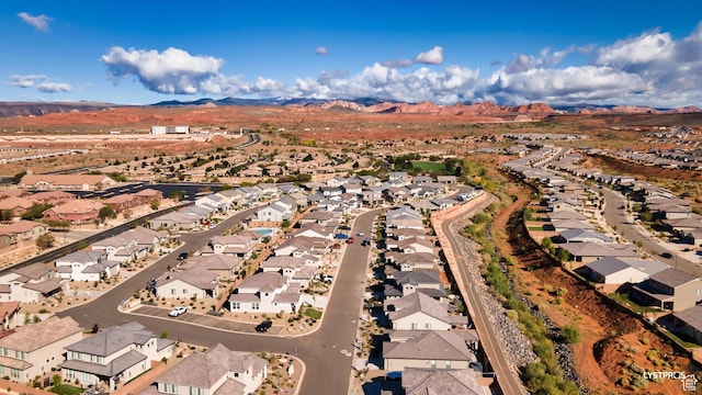 273 N Puerta Dr W, Washington, UT 84780 - aerial view of property and surrounding area with nearby suburban area and a mountainous background