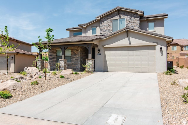 273 N Puerta Dr W, Washington, UT 84780 - view of front of house with stone siding, stucco siding, driveway, and a tiled roof