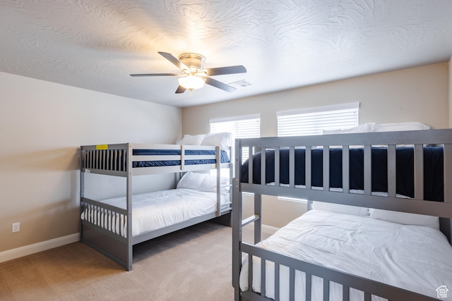 273 N Puerta Dr W, Washington, UT 84780 - carpeted bedroom featuring multiple windows, baseboards, and ceiling fan