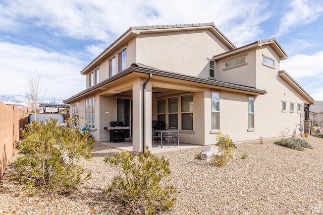 273 N Puerta Dr W, Washington, UT 84780 - back of house featuring fence, a patio, and stucco siding