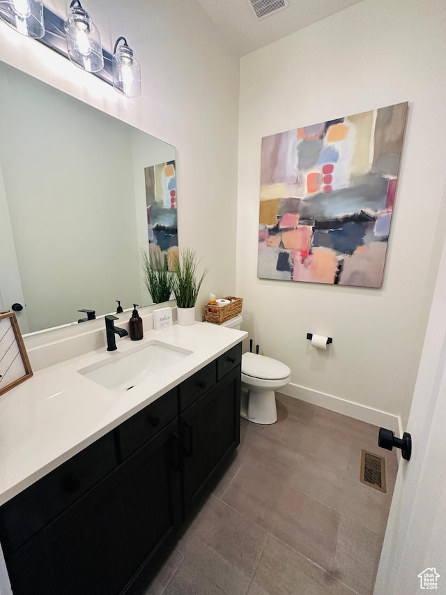 39 W Tamarind Way, Garden City, UT 84028 - bathroom with toilet, vanity, baseboards, and tile patterned floors