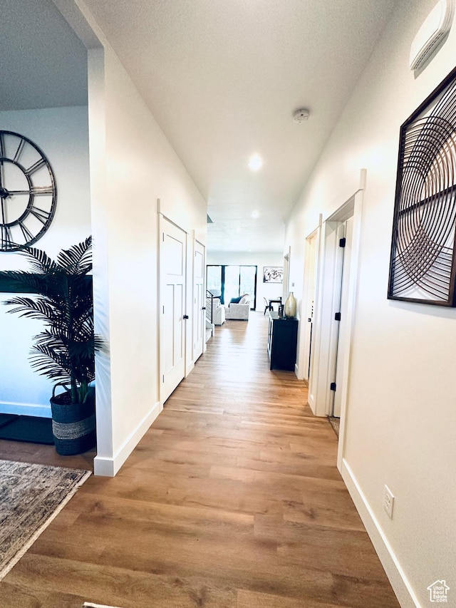 39 W Tamarind Way, Garden City, UT 84028 - corridor featuring wood finished floors, baseboards, and recessed lighting