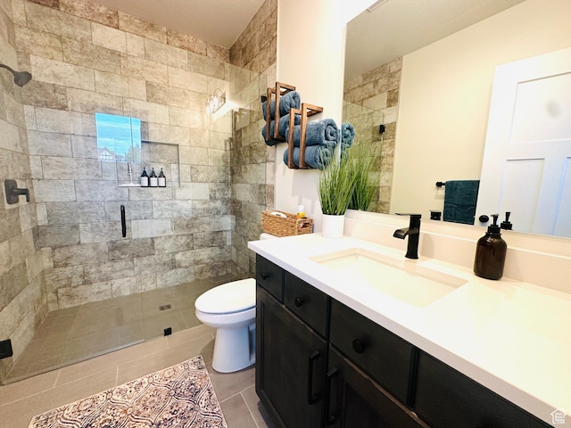 39 W Tamarind Way, Garden City, UT 84028 - bathroom with a stall shower, toilet, vanity, and tile patterned flooring