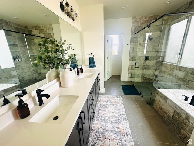 39 W Tamarind Way, Garden City, UT 84028 - full bathroom featuring tile patterned flooring, a shower stall, double vanity, and a relaxing tiled tub