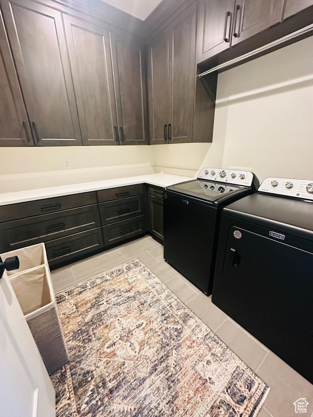 39 W Tamarind Way, Garden City, UT 84028 - clothes washing area with cabinet space, separate washer and dryer, and light tile patterned floors