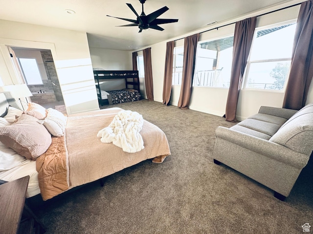 39 W Tamarind Way, Garden City, UT 84028 - carpeted bedroom with multiple windows, baseboards, and a ceiling fan