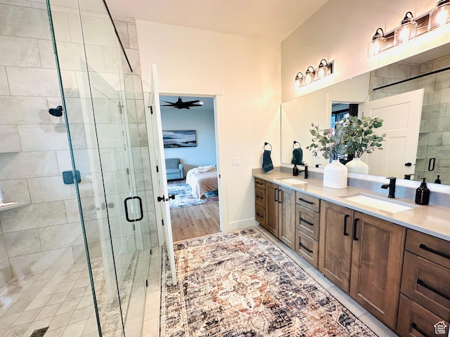 39 W Tamarind Way, Garden City, UT 84028 - bathroom featuring a stall shower, ensuite bathroom, double vanity, and ceiling fan