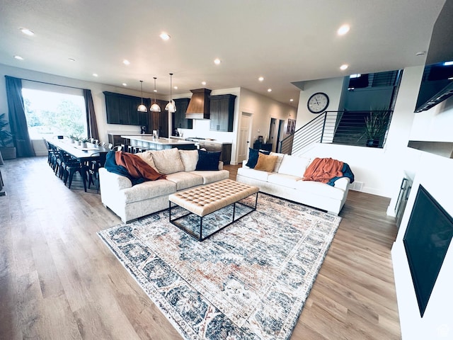 39 W Tamarind Way, Garden City, UT 84028 - living area with light wood-style floors, recessed lighting, and stairs