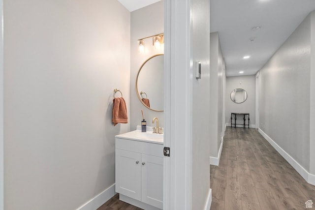 8 Snow Forest Cv, Sandy, UT 84092 - bathroom with wood finished floors, baseboards, vanity, and recessed lighting