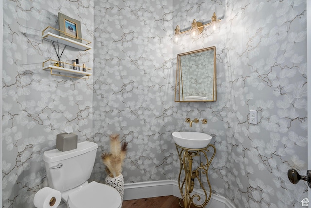 8 Snow Forest Cv, Sandy, UT 84092 - half bathroom with wood finished floors, a sink, toilet, and baseboards