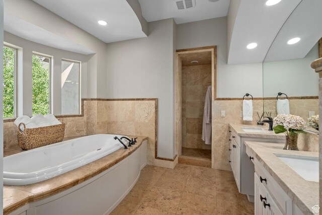 8 Snow Forest Cv, Sandy, UT 84092 - bathroom featuring vanity, a garden tub, a shower stall, and recessed lighting
